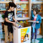  Students delivering books to donation bin
